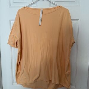 Lululemon Peach loose fitting top. Size 10